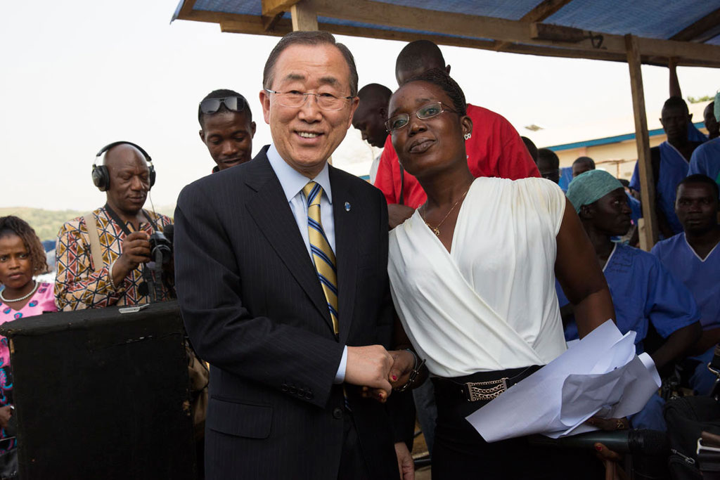 Secretary-General Ban Ki-moon meets with Rebecca Johnson, a nurse and survivor of Ebola, at the Ebola Treatment Unit PTS1 in Hastings, near Freetown, Sierra Leone, during a visit in December 2014. UN Photo/Martine Perret