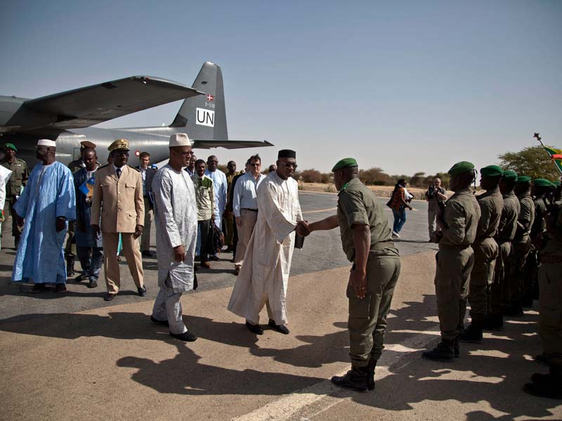 Mali's Minister of Culture, Bruno Maiga, is greeted as arrives in Timbuktu for the official launch of the World Heritage mausoleums. Photo: MINUSMA/Marco Domino
