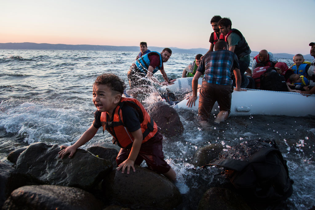 Syrian refugees arrive on the Greek island of Lesvos - the main point of entry for refugees to Europe – after making the perilous crossing from Turkey in a rubber raft.  UNHCR/Andrew McConnell