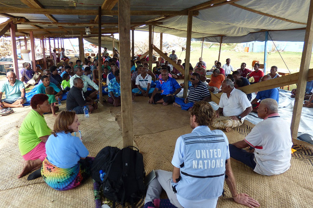 Koro, Fiji, 2016:The Humanitarian Coordinator, Osnat Lubrani and the Head of UNOCHA Pacific, Sune Gudnitz attended a community meeting in Koro where local leaders expressed their urgent need for shelter and their desire to see communities relocated to higher ground, reducing future risk from storm surge. Photo: Danielle Parry/OCHA