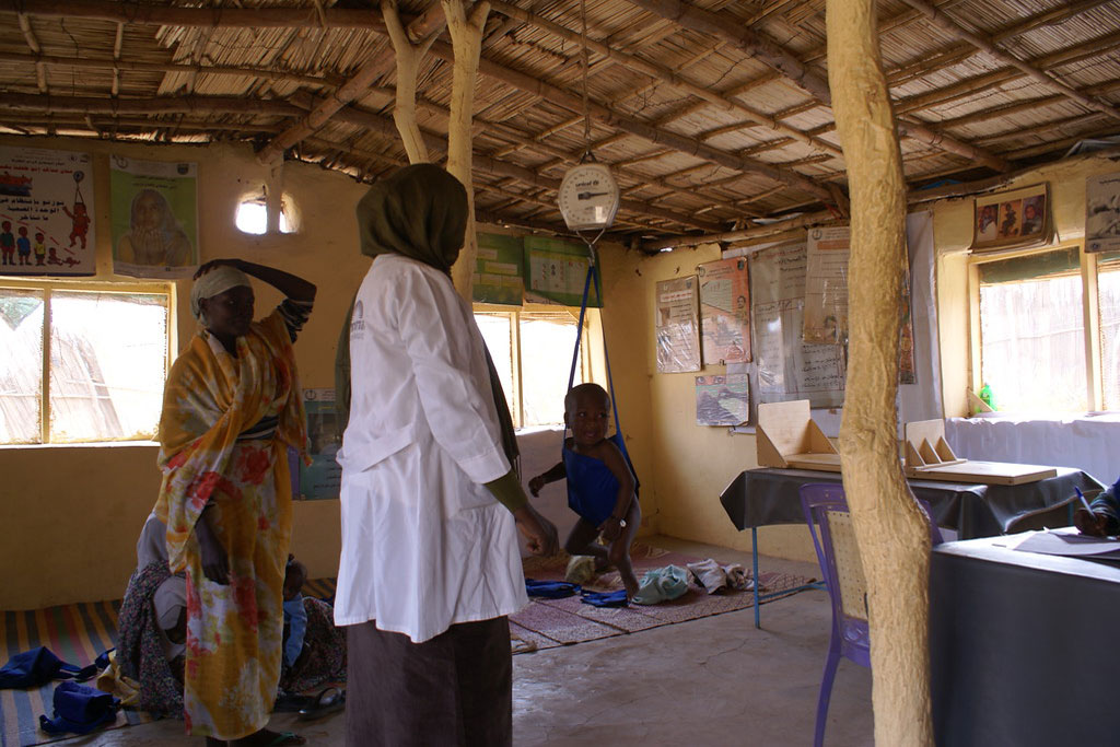 Weighing children at Al Manar Health Center, Mayo, South Khartoum Photo: OCHA