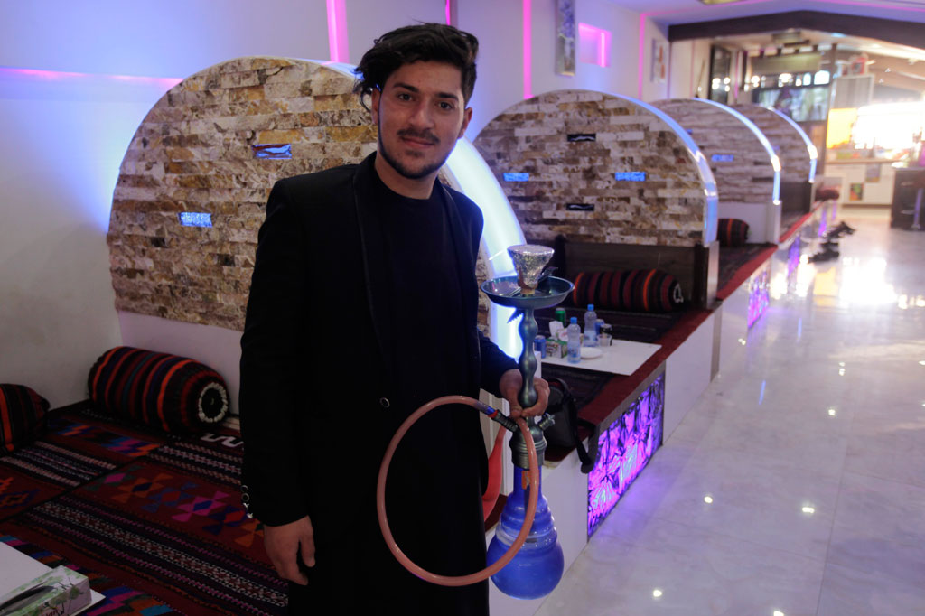 Aresh Majedi, seen here at a shisha café in Herat, wants the Government to make Afghanistan a safer place to live. Photo: Fraidoon Poya