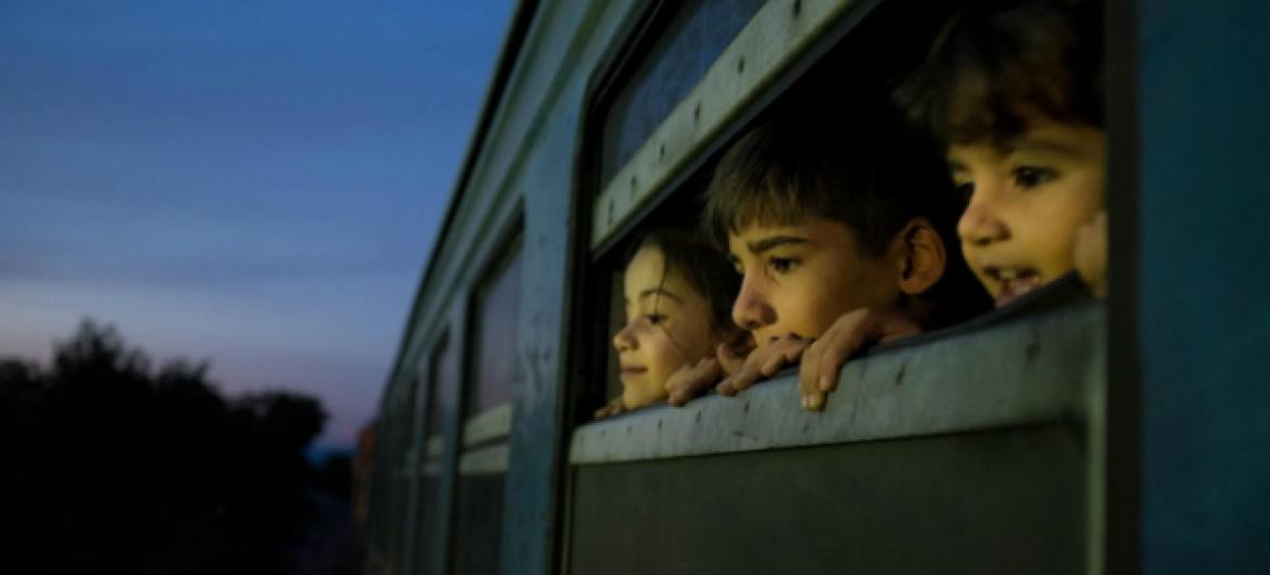 Children on a train at a reception centre for refugees and migrants in Gevgelija in the Former Yugoslav Republic of Macedonia.