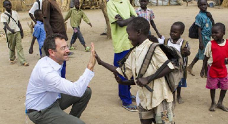 Toby Lanzer, the Humanitarian Coordinator of the UN Mission in South Sudan (UNMISS), interacts with children at the refugee camp in Nyeel, South Sudan.