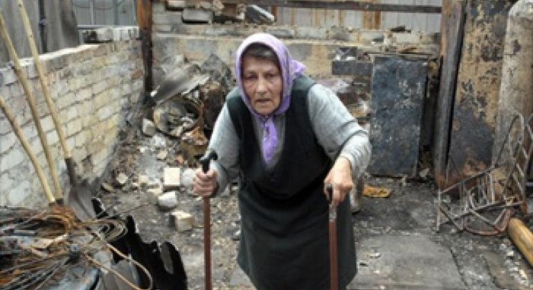 A resident of the Artema suburb of Sloviansk, Ukraine, in the rubble of what used to be her summer kitchen, in July 2014.
