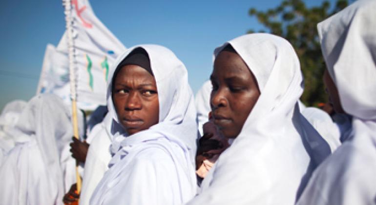 Students of a midwifery school in El Fasher, North Darfur, participate in a march against Gender Violence.