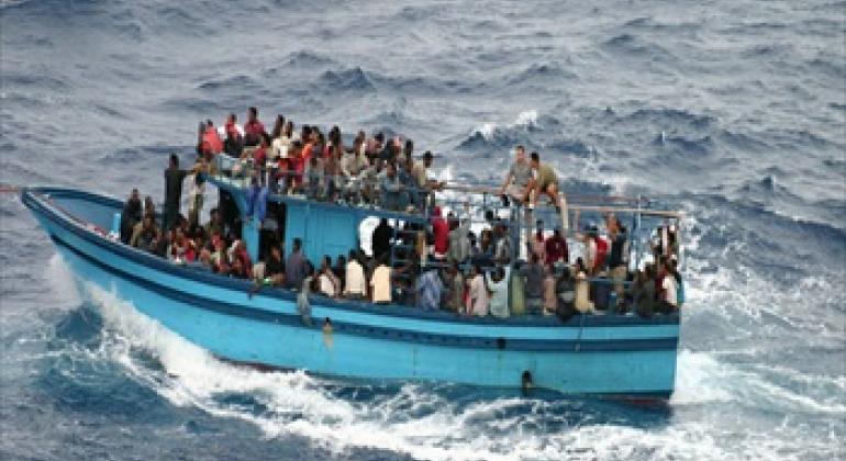 A boat carrying asylum seekers and migrants in the Mediterranean Sea.