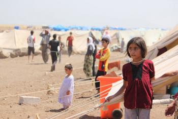 Yazidi refugees, including several children, go about their lives in Nawrouz refugee camp, approximately 40 kilometres from the Syrian border with Iraq.