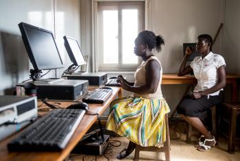 A woman in South Sudan is learning to access and browse the Internet.
