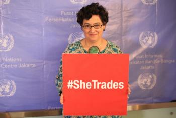 Executive Director of ITC, Ms. Arancha González holding #SheTrades placard. File