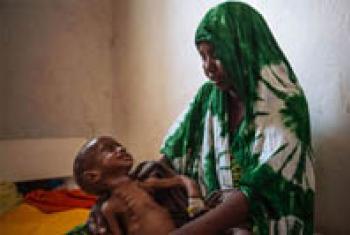 A two year-old child cries for his mother at the Kismayo general hospital in Somalia.