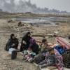 Família deslocada pelos combates no vilarejo de Shora, a 25 quilômetros de Mosul. Foto: Acnur/Ivor Prickett